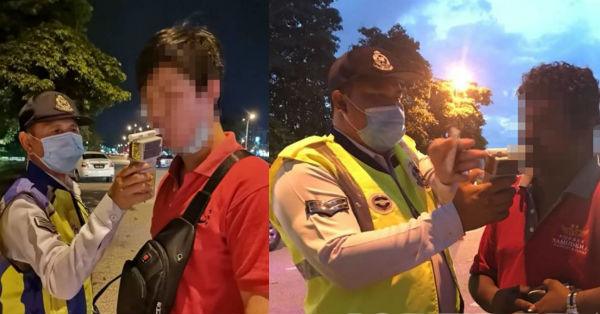 警方在醉酒行动为驾驶人士，进行酒气检测。