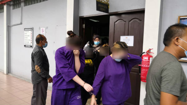 4名华裔女子被带往怡保地庭延扣21天。